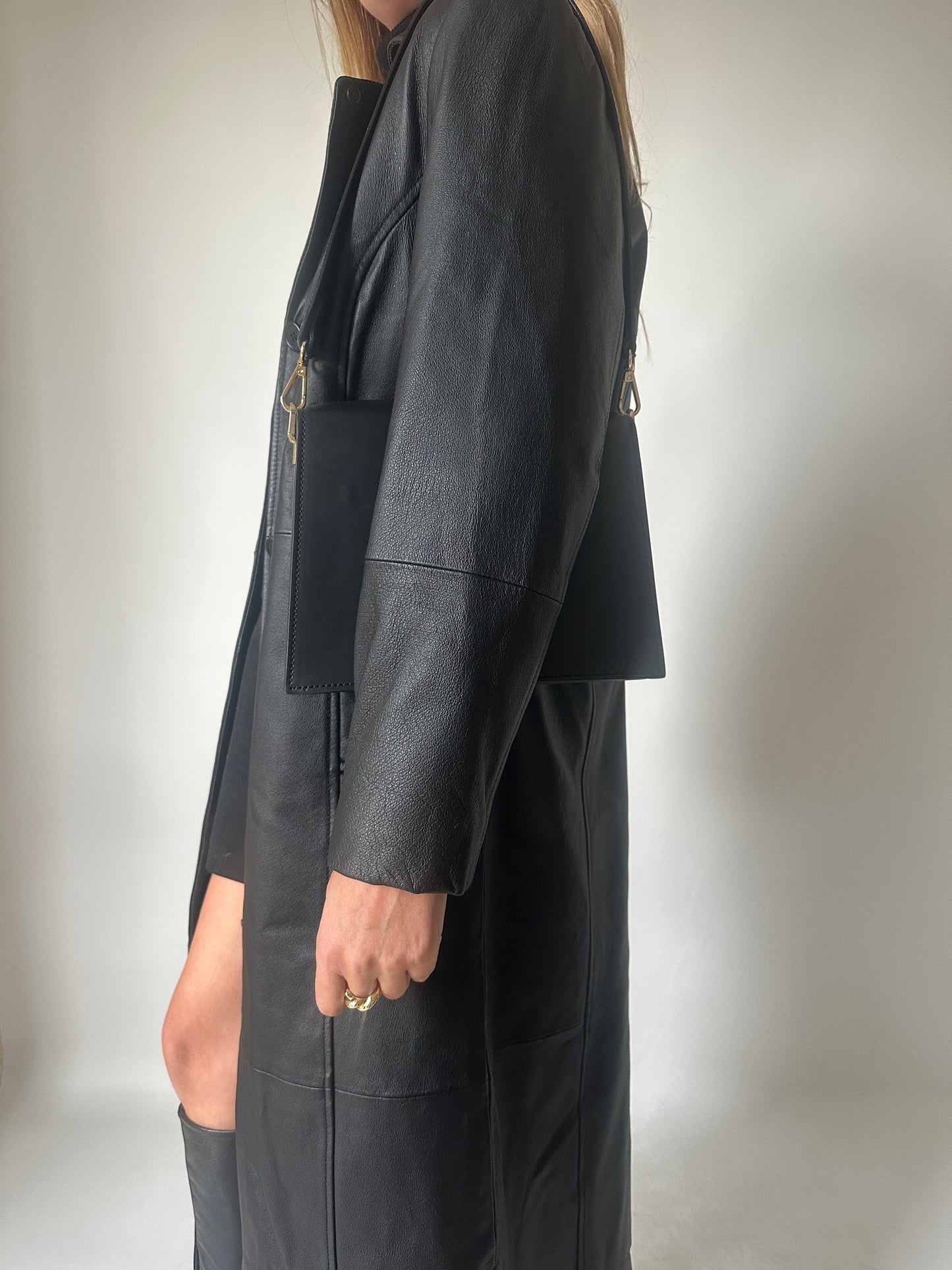 Iconic extra long black leather trench
