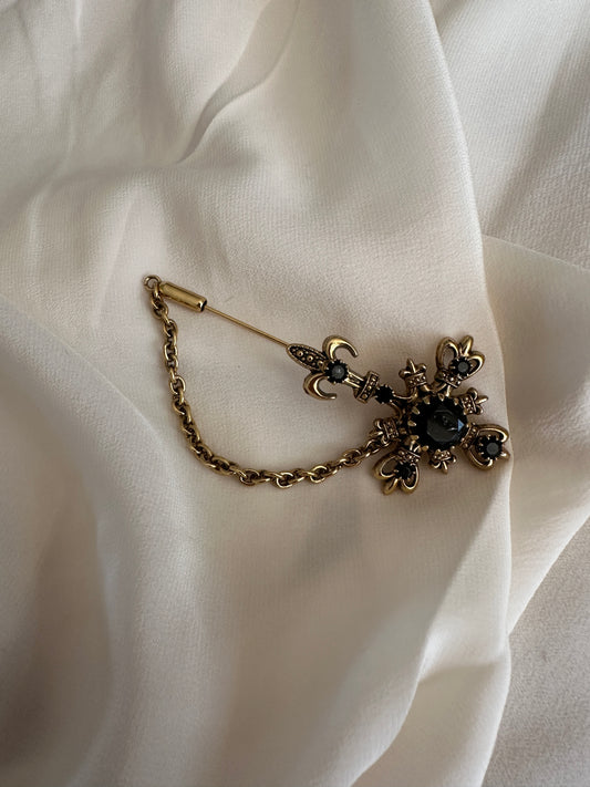 Spilla fiore con catenella