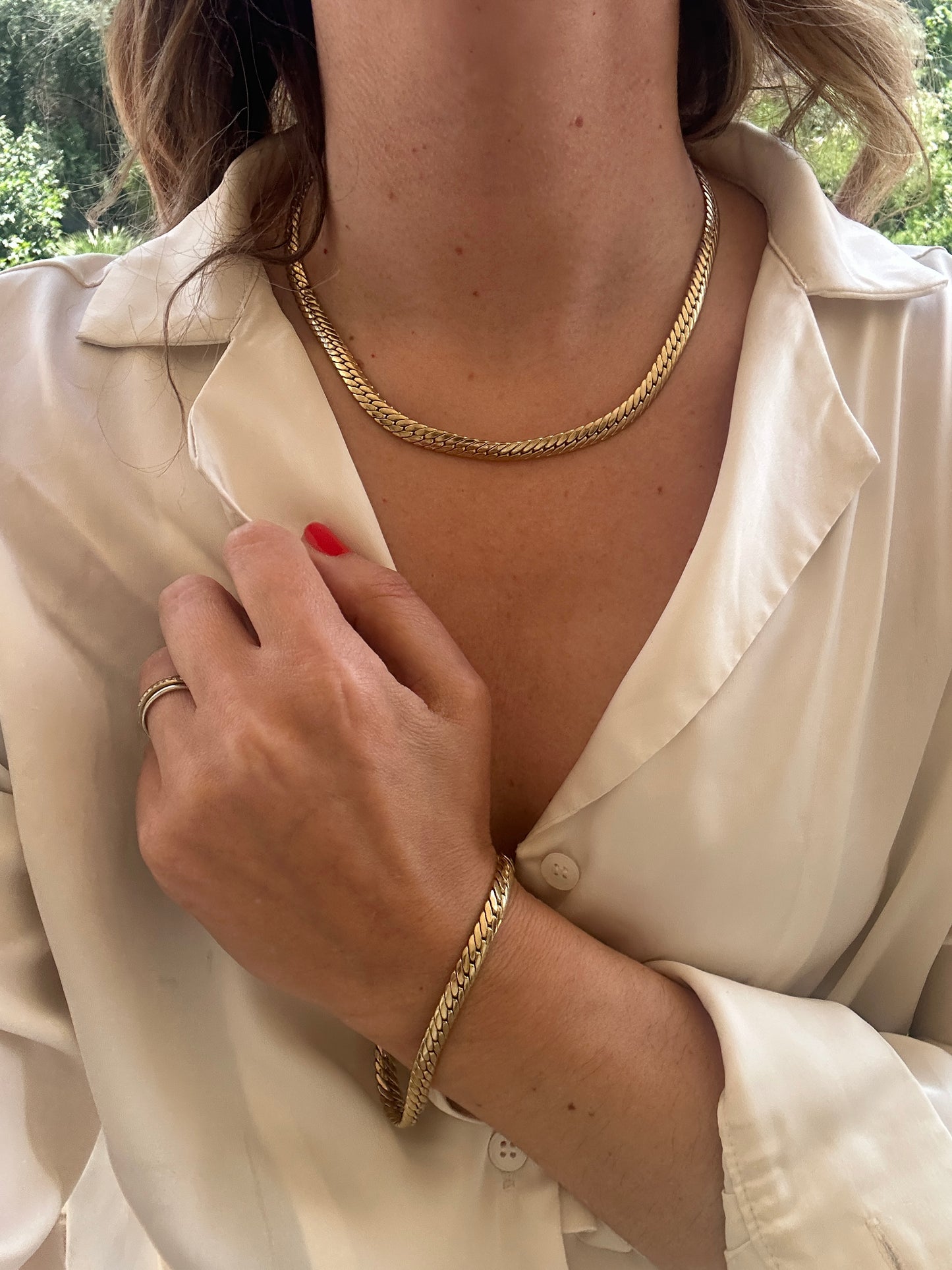 Parure girocollo e bracciale snake placcato oro
