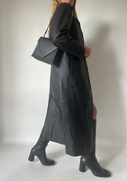 Iconic extra long black leather trench