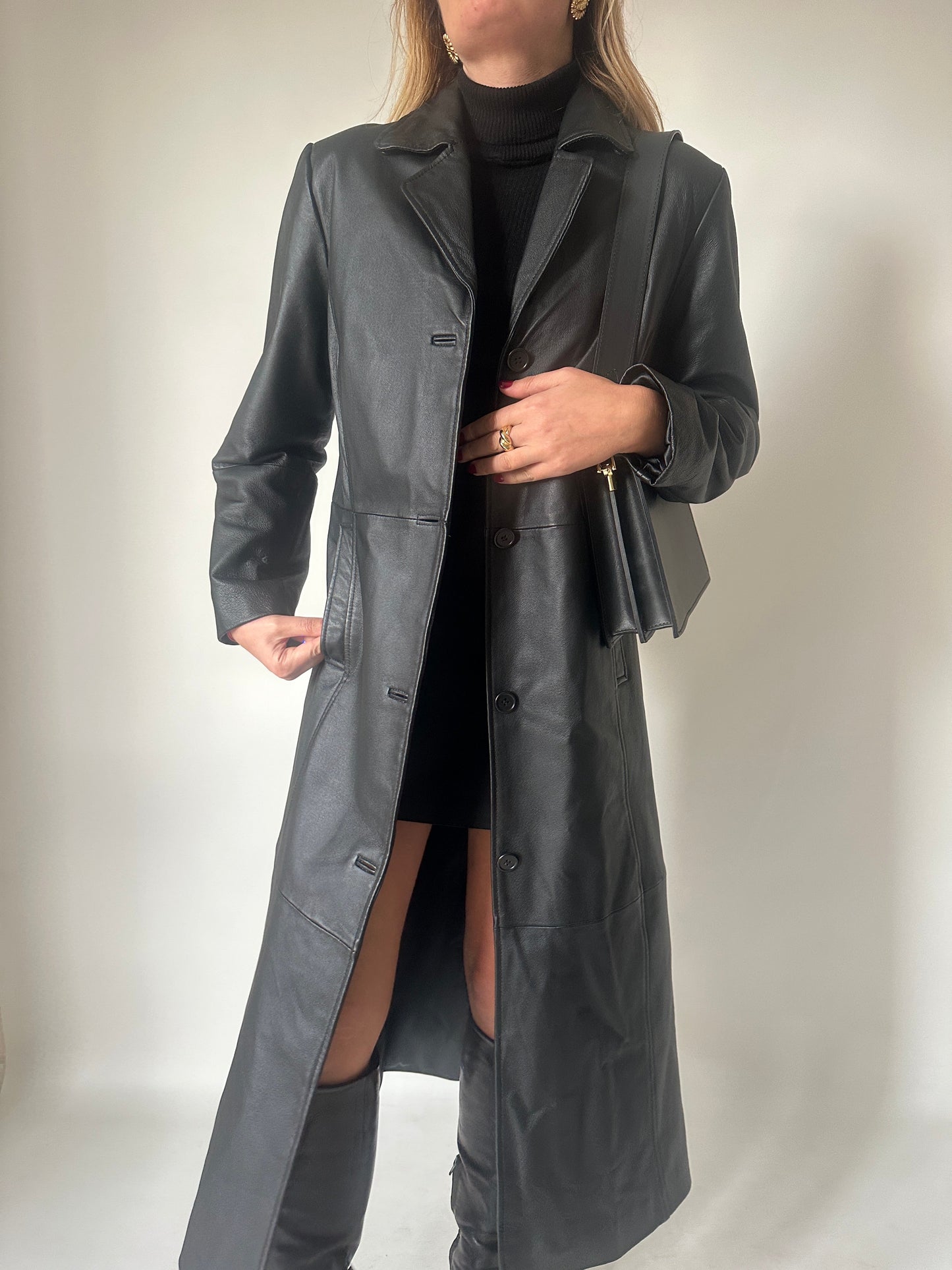 Iconic extra long black leather trench