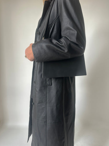 Iconic extra long black leather trench