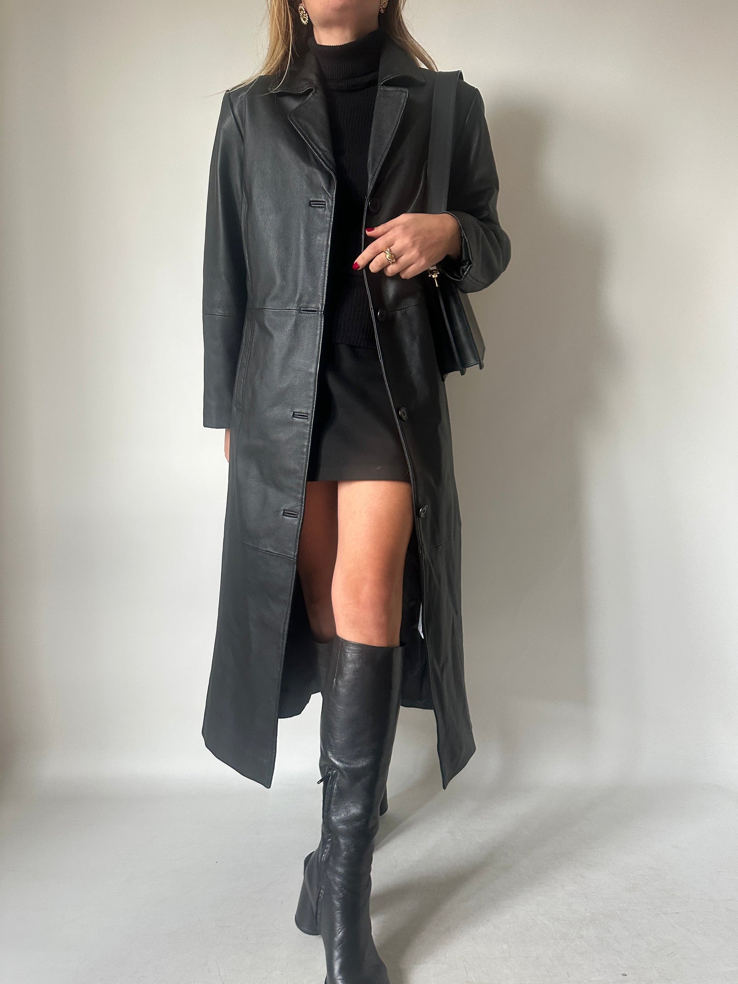 Iconic extra long black leather trench