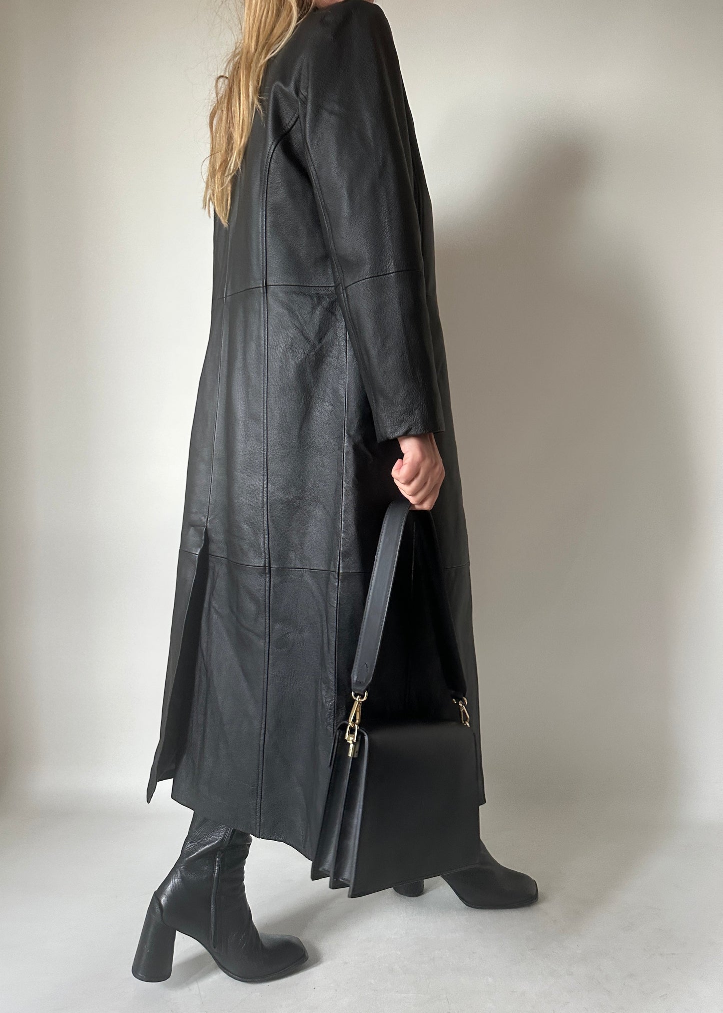 Iconic extra long black leather trench