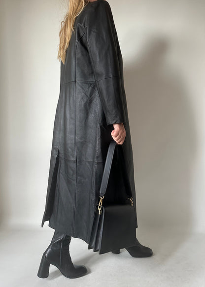 Iconic extra long black leather trench