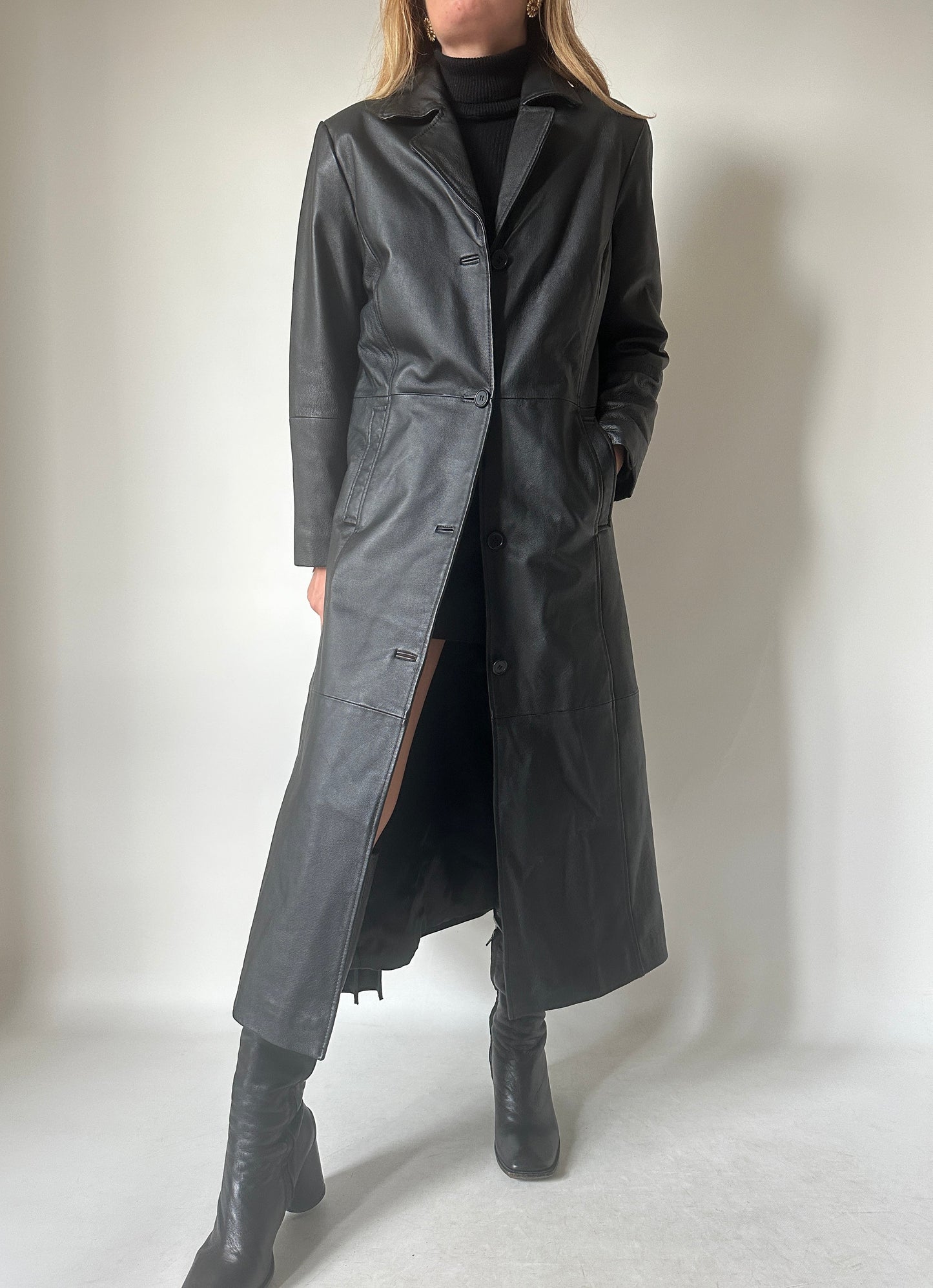 Iconic extra long black leather trench