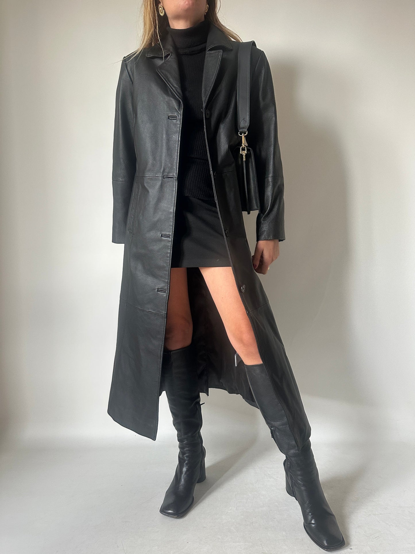 Iconic extra long black leather trench