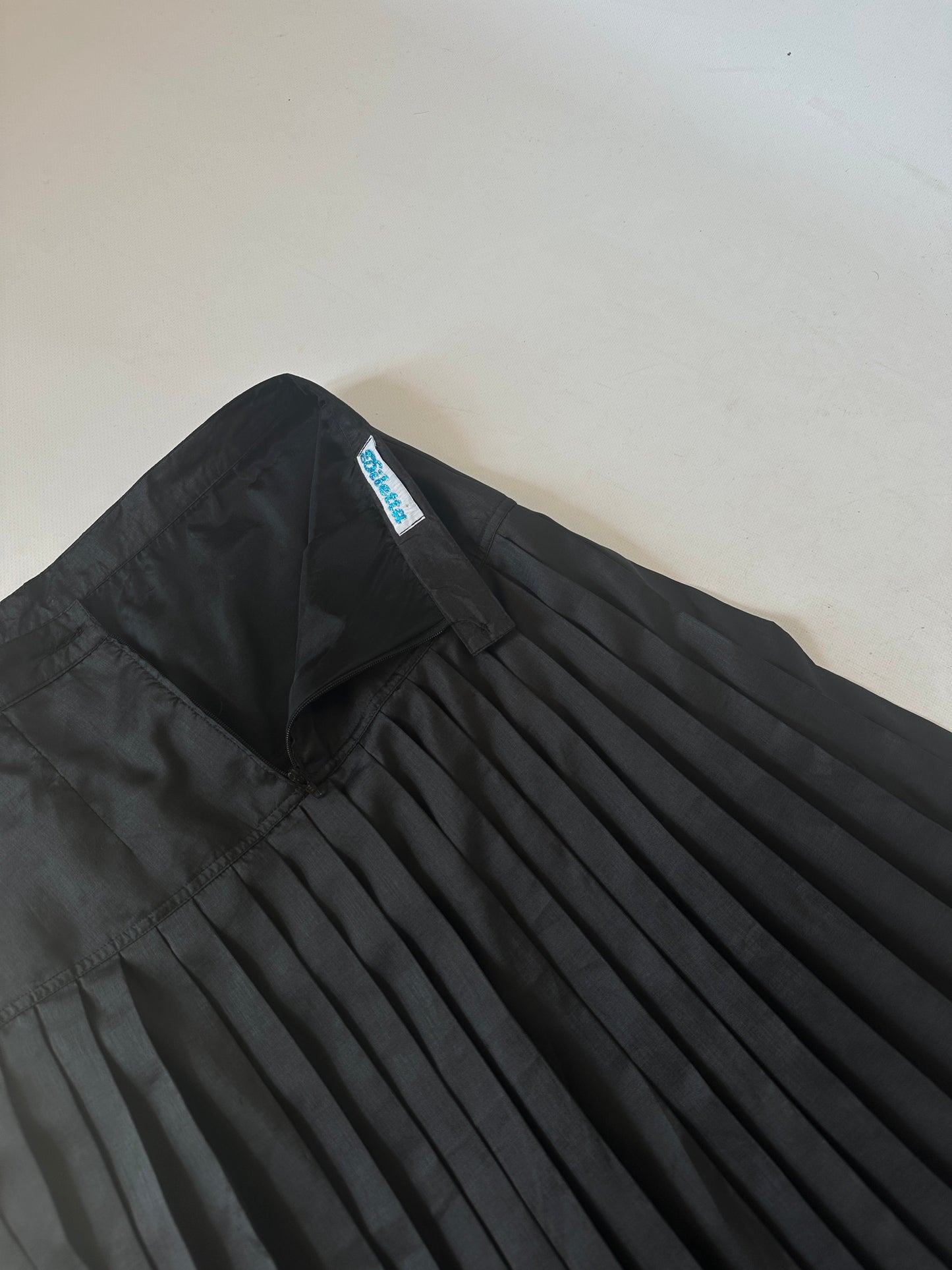 Minimal black pleated silk skirt